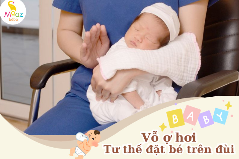 Vỗ ợ hơi - tư thế đặt bé trên đùi