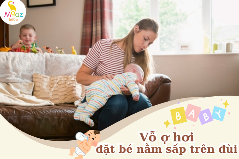 Vỗ ợ hơi - tư thế đặt bé nằm sấp ngang trên đùi