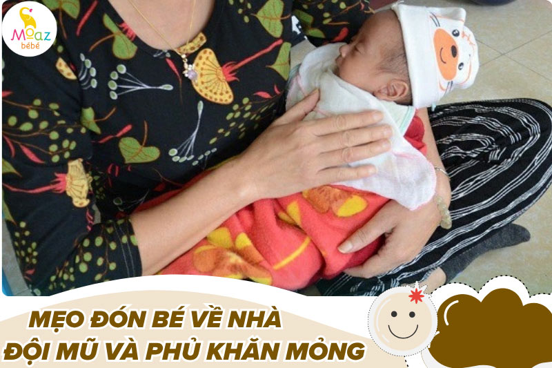 Khi bế bé dời viện nên đội mũ và phủ khăn mỏng